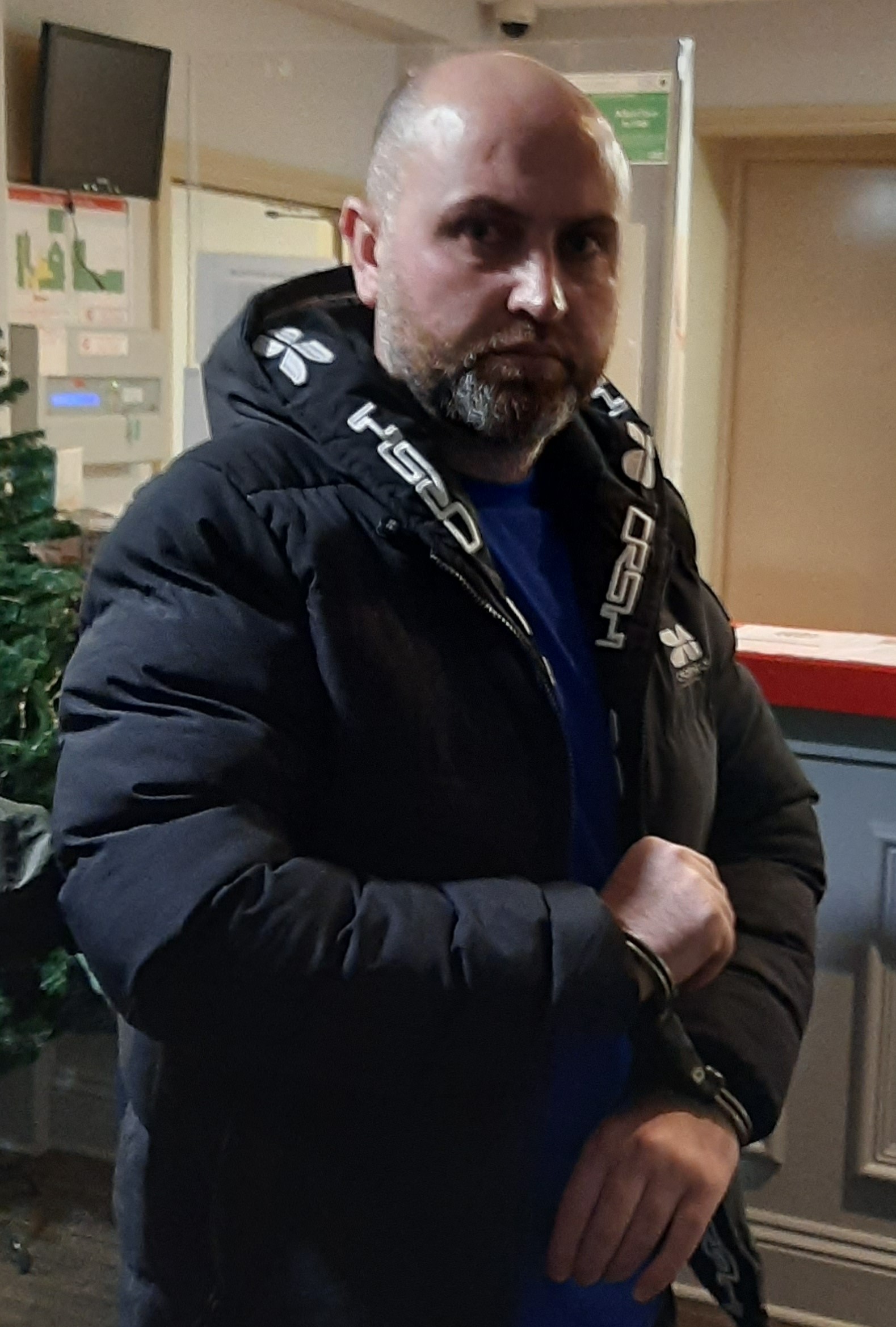 Abwbaker in handcuffs